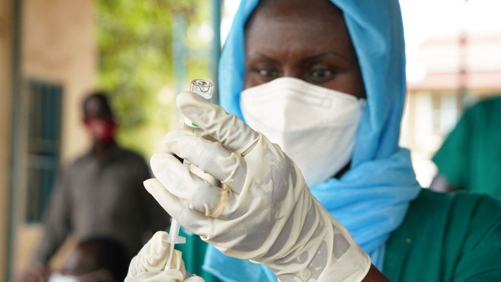 A health worker prepares to administer a vaccine in South Sudan