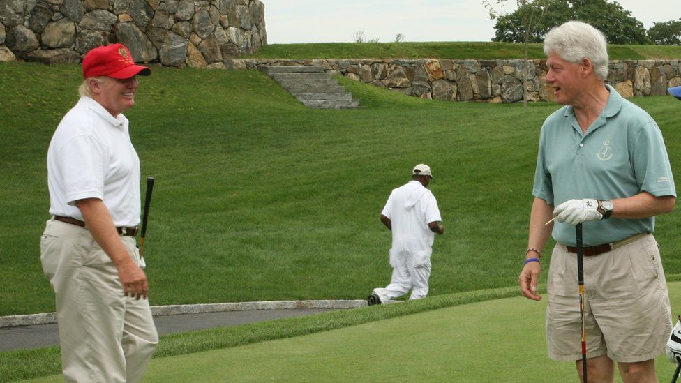 Donald Trump and Bill Clinton talk on the golf course.