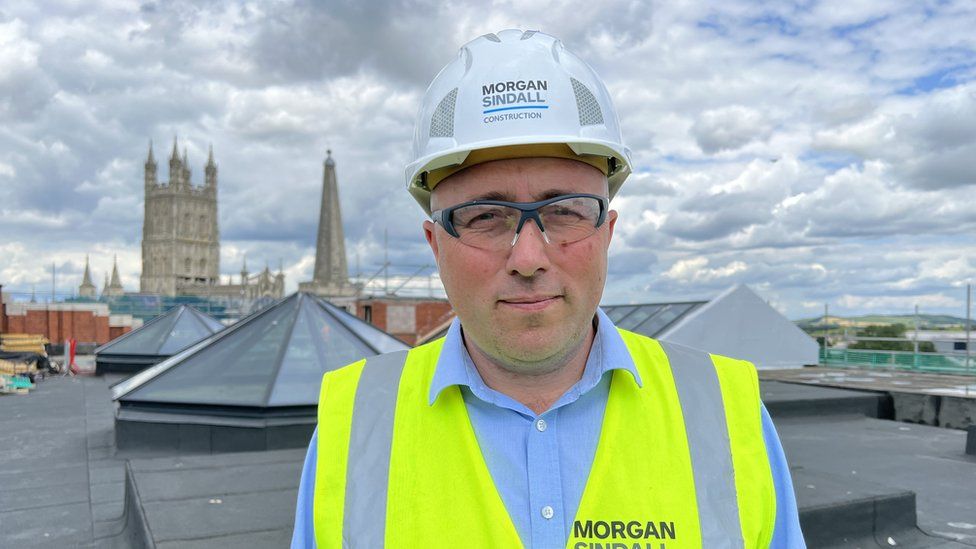James Lawley, senior project manager at developer Morgan Sindall, on a rooftop in Gloucester