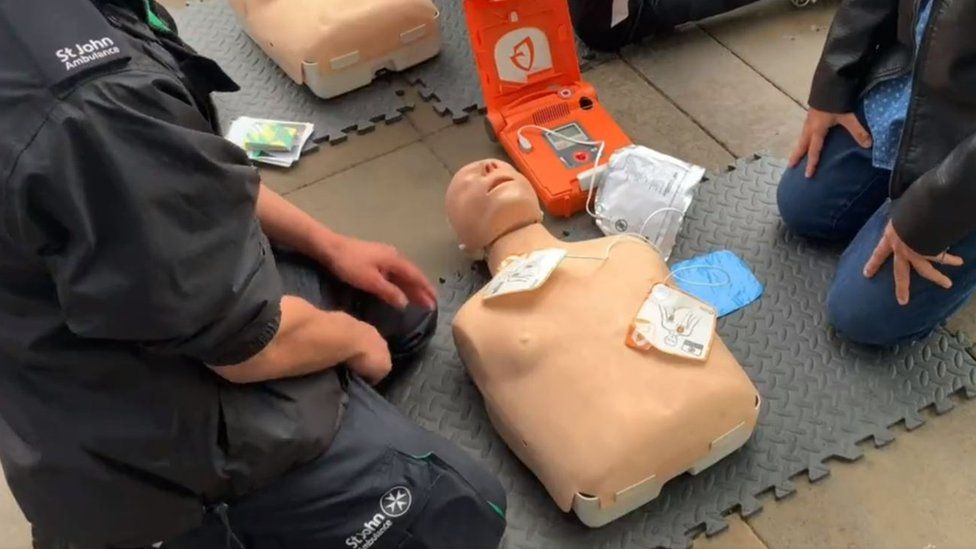 St John Ambulance demonstrating defibrillator