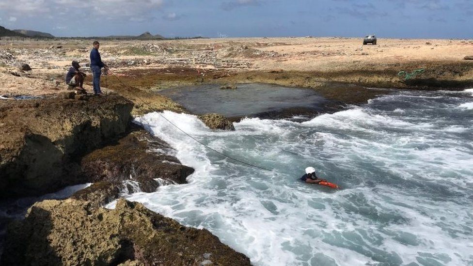 Police officers look for belongings and evidences at the shore Willemstad, Curacao 11 January, 2018.