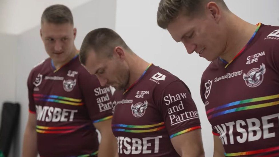 Three Manly players model the pride jersey