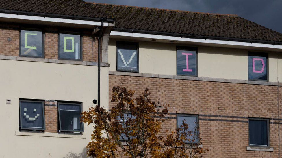 Covid written in student halls windows in Cardiff