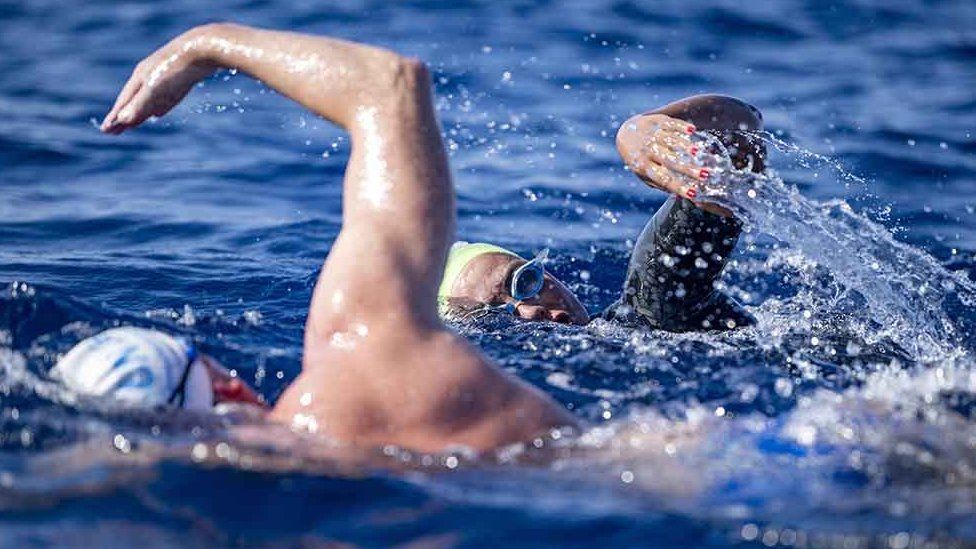 Lewis Pugh and Dr Mariam Saleh Bin Laden swimming together