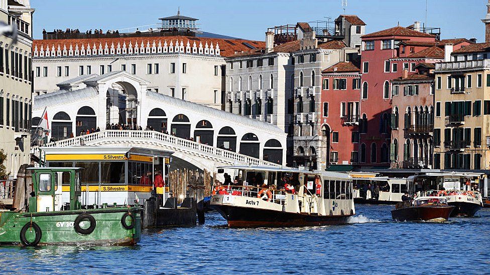 Vaporetti and other craft on the Grand Canal, Venice, by the Rialto Bridge