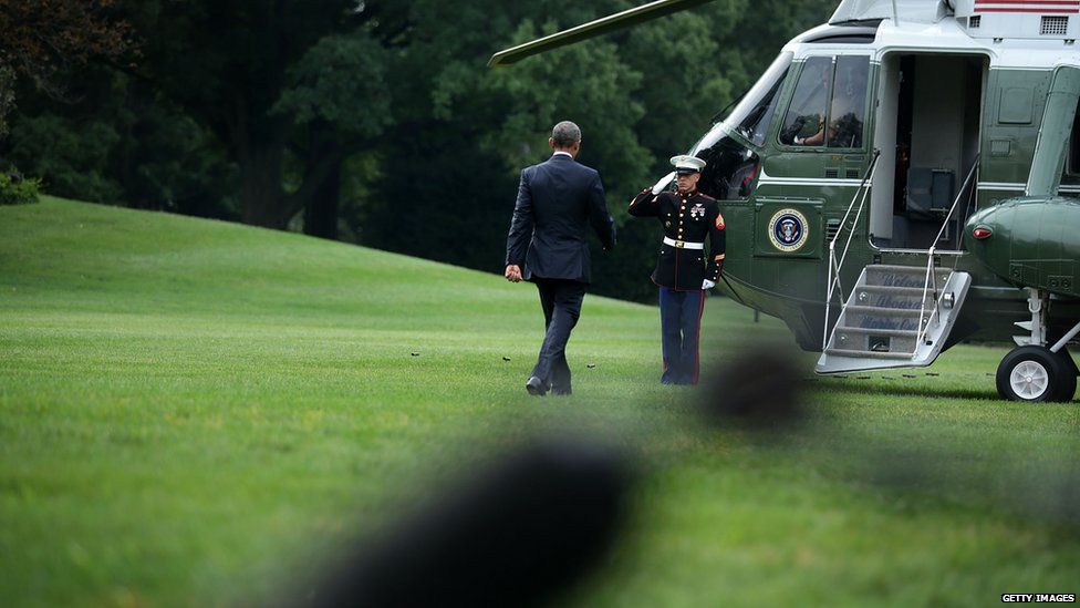 US President Barack Obama walks towards the Marine One prior to his departure from the White House 31 August 2015 in Washington, DC.