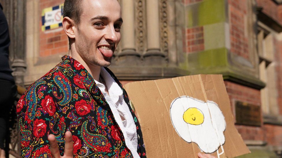 Patrick Thelwell arriving astatine  York Magistrates' Court holding up   an ovum  sign