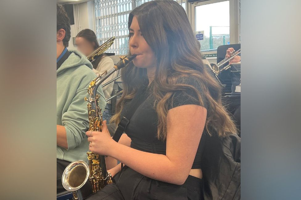 Ingrid playing the saxophone
