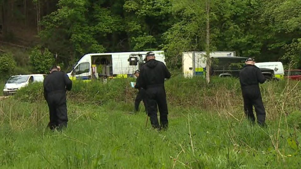 Police search grassland