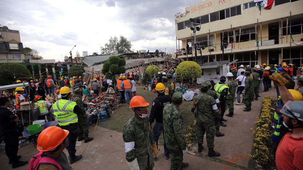 A schoolyard built for children to play in brims with rescue workers hoping to free anyone left alive in the ruins of collapsed classrooms at Enrique Rébsamen school, Mexico City, 20 September 2017