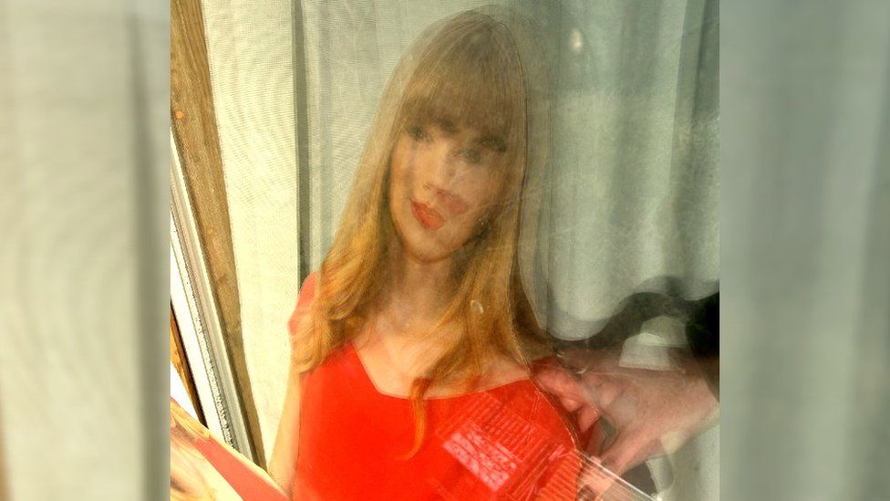 Taylor Swift cut-out in window