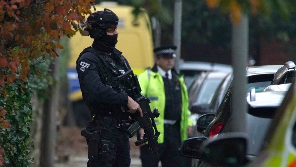 An armed police officer