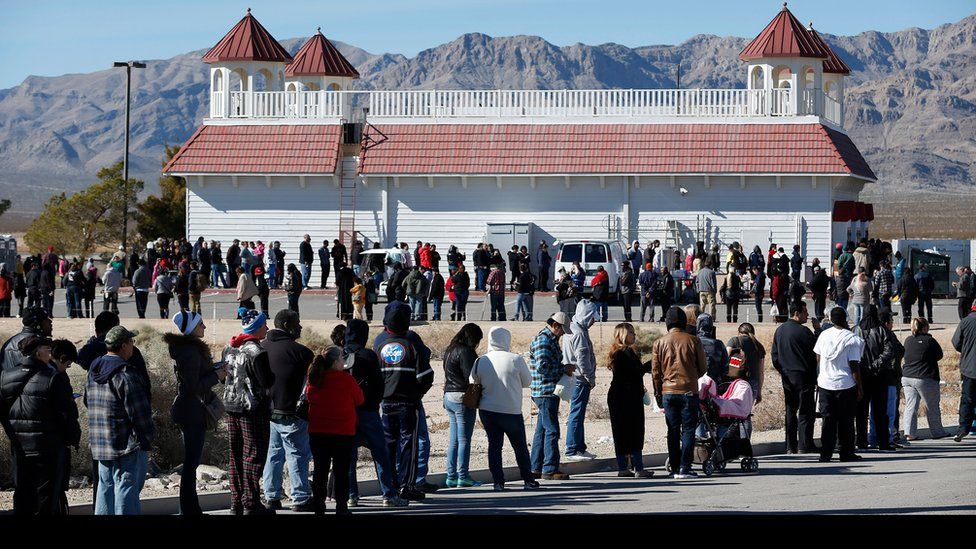 Patrons line up to buy Powerball lottery tickets outside the Primm Valley Casino Resorts Lotto Store just inside the California border Tuesday, Jan. 12, 2016, near Primm, Nevada.