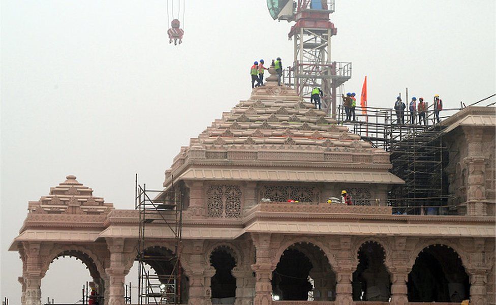 Workers atop the under construction Ram Temple in Ayodhya, Uttar Pradesh, India, on Friday, Dec. 29, 2023.