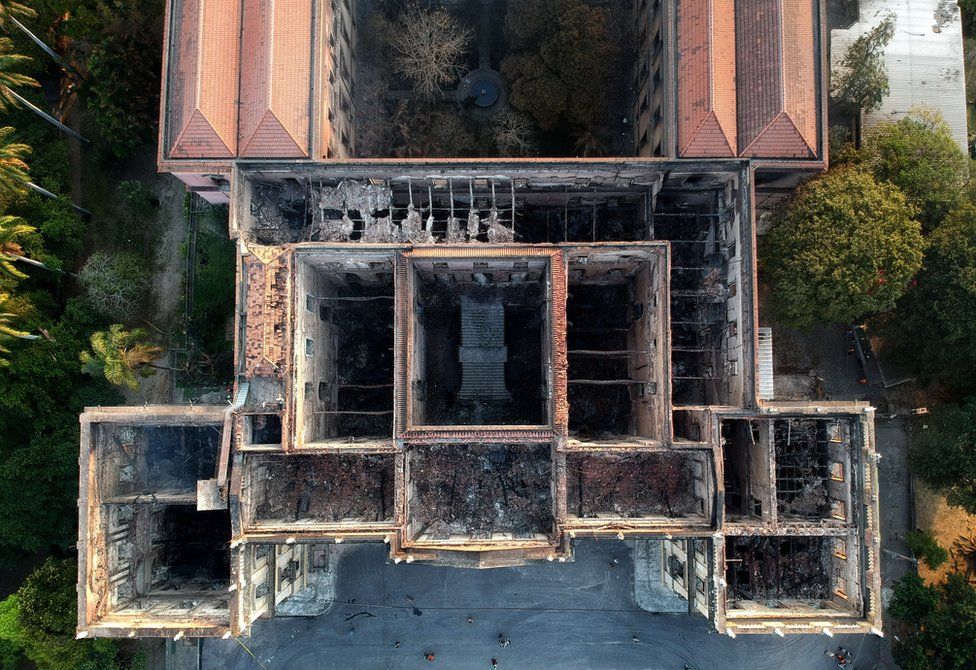 An aerial view of a museum gutted by a fire