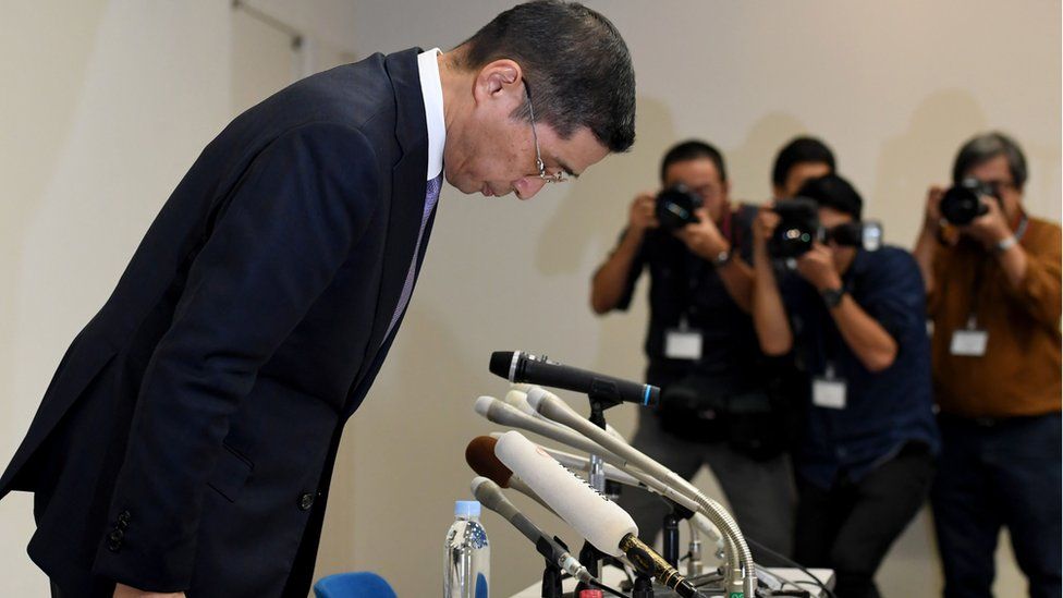 Nissan Motors chief executive Hiroto Saikawa bows at a press conference in Japan in October