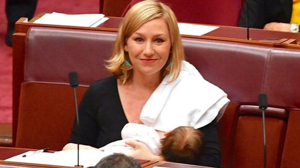 Senator Larissa Waters breastfeeds her daughter Alia Joy in Australian parliament.