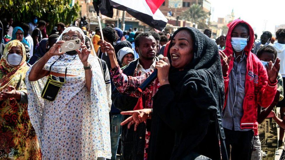 A Sudanese woman speaks during in a rally to protest against last year's military coup, in the capital Khartoum, on January 30, 2022