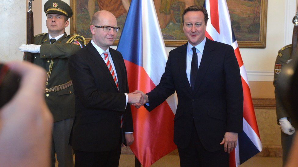 Czech Prime Minister Bohuslav Sobotka (L) shakes hand with his British counterpart David Cameron in Prague