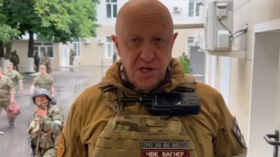 A screengrab from a video which shows Wagner chief Yevgeny Prigozhin making a speech at the Headquarters of the Southern Military District, surrounded by fighters in Rostov-on-Don, Russia on 24 June, 2023