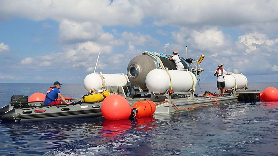 The Titan sub being prepared connected  the surface