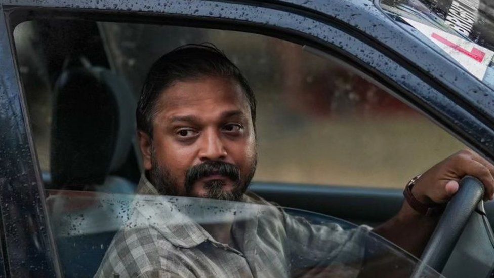 Sudhi Kozhikode seen driving a car in the film