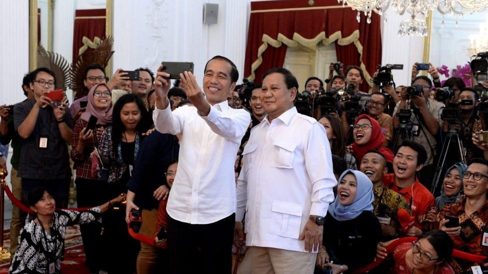 Joko Widodo and Prabowo Subianto pose for a selfie