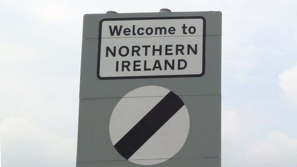 Traffic passes a Northern Ireland border sign at Newry