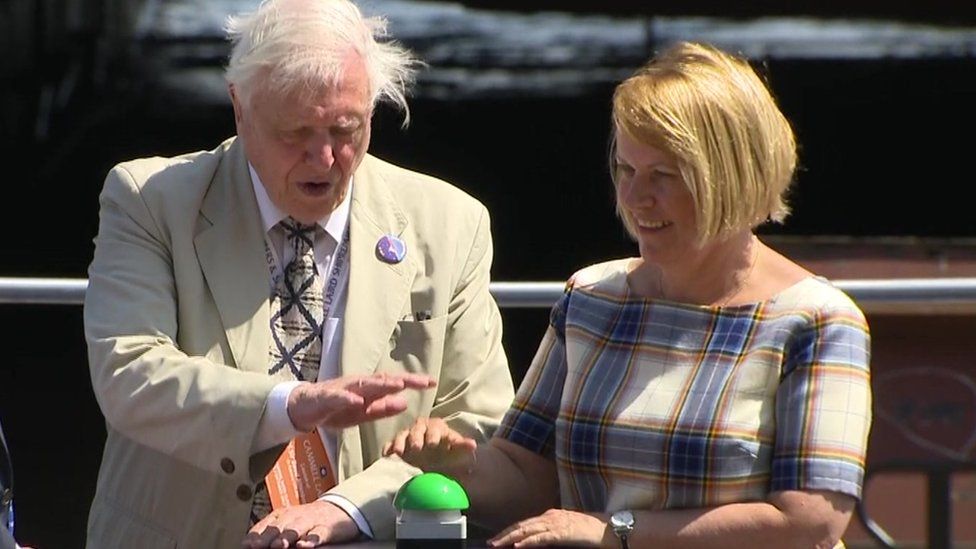 Sir David Attenborough presses button