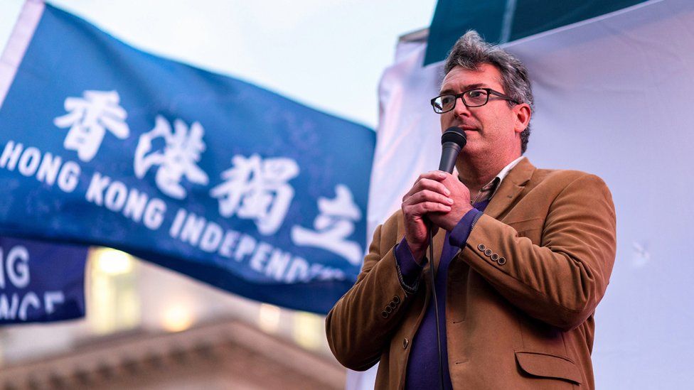 Benedict Rogers speaking at a rally in London in 2021