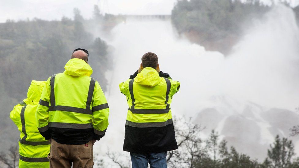 California Department of Water Resources staff monitoring the water flowing through the damaged spillway on Friday 10 February