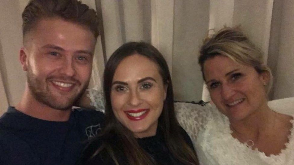 Josh Darcy with his sister and mother