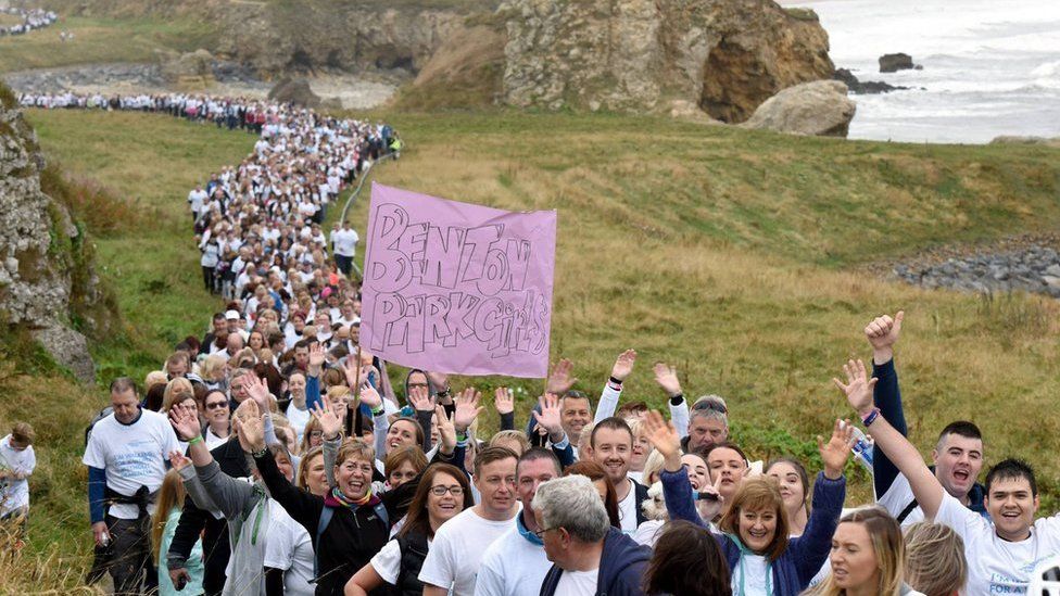 Thousands of walkers make their way along the coastal route