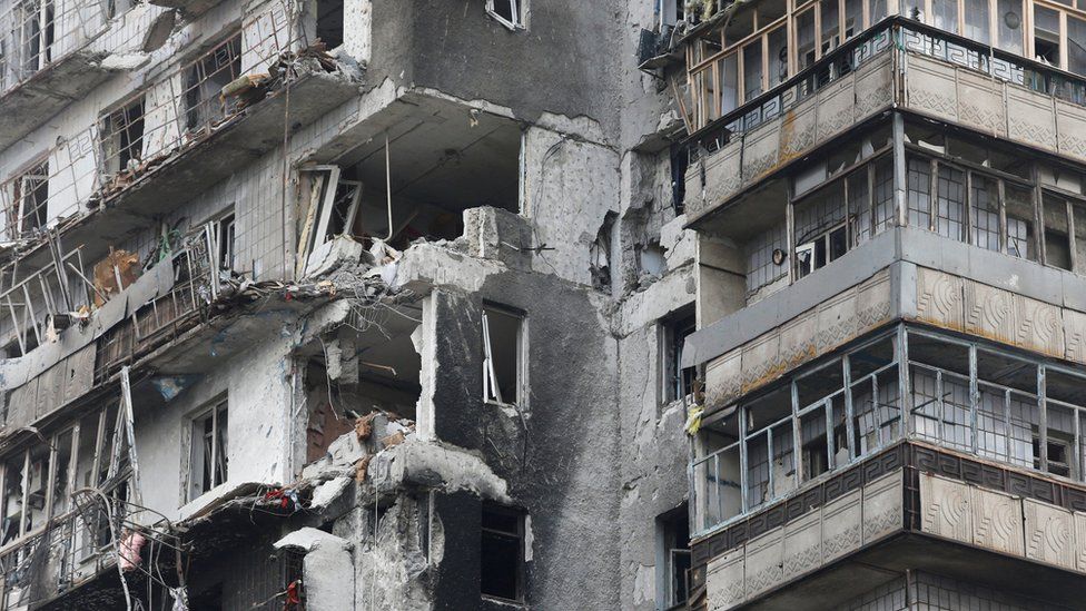 A damaged residential building in Mariupol