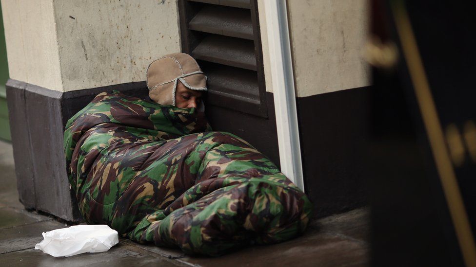 Homeless man sleeps on the streets in London