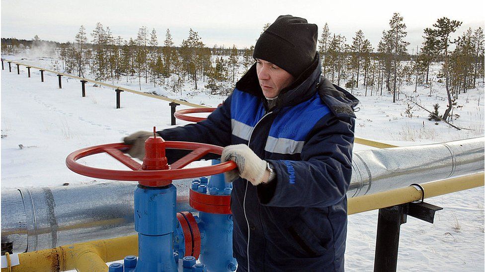 Worker with gas pipe