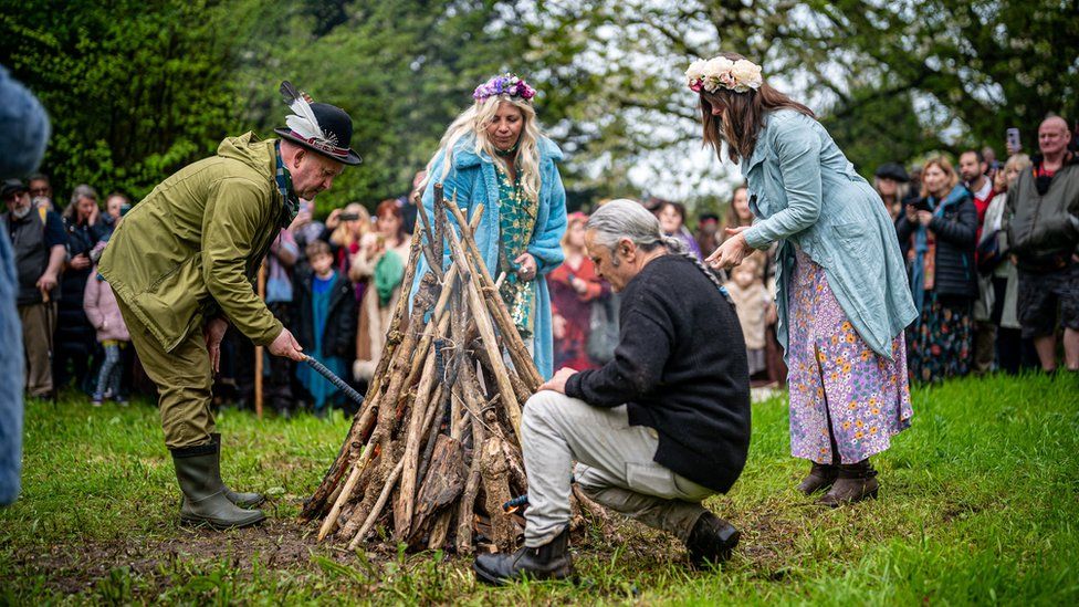 The Beltane bonfire is lit during the ceremony at Chalice Well, Glastonbury, Somerset, 2023