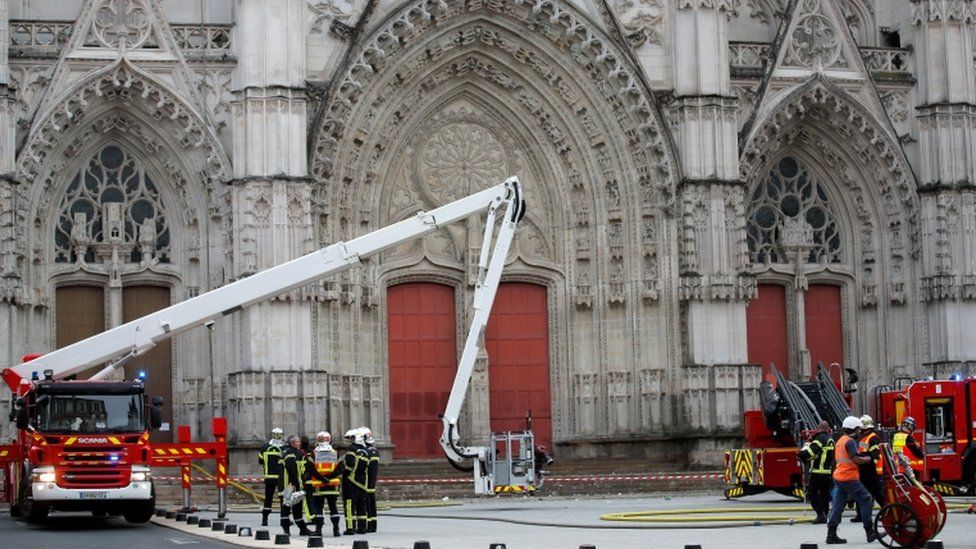 French firefighters work at the scene of the blaze