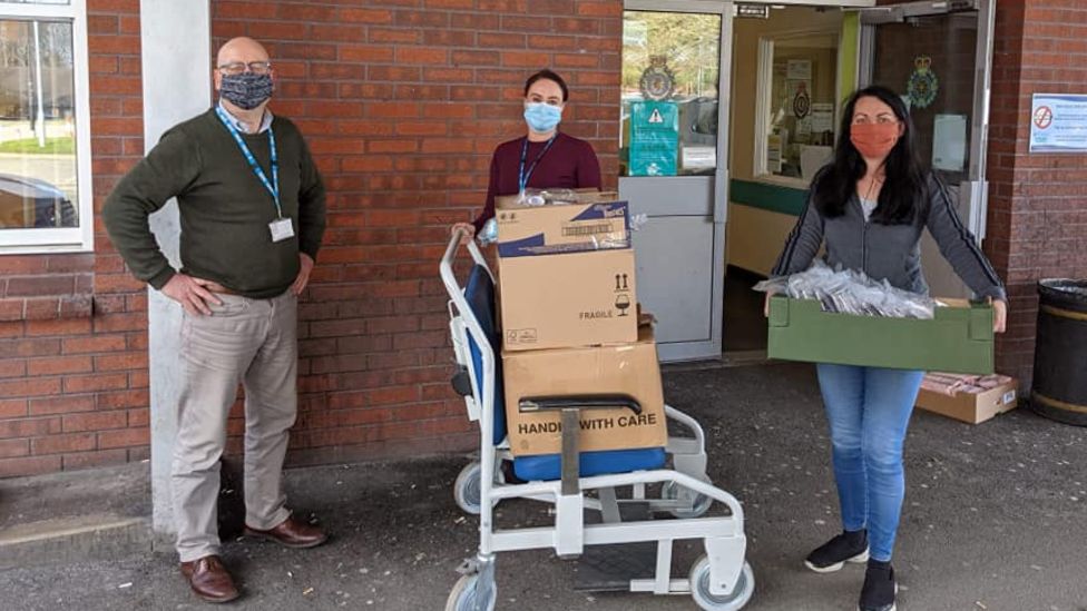 Handing over goody bags to NHS staff