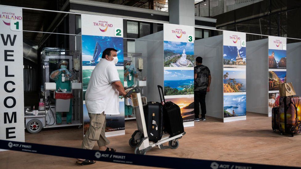 International passengers receive covid-19 coronavirus swab testing at the testing booth after arriving Phuket International Airport