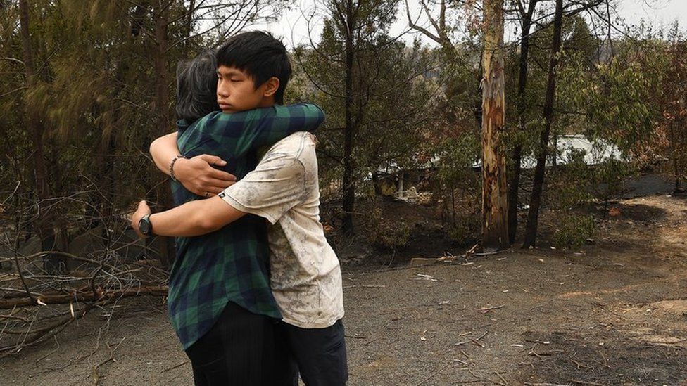 Gabriel Kam hugs his mother