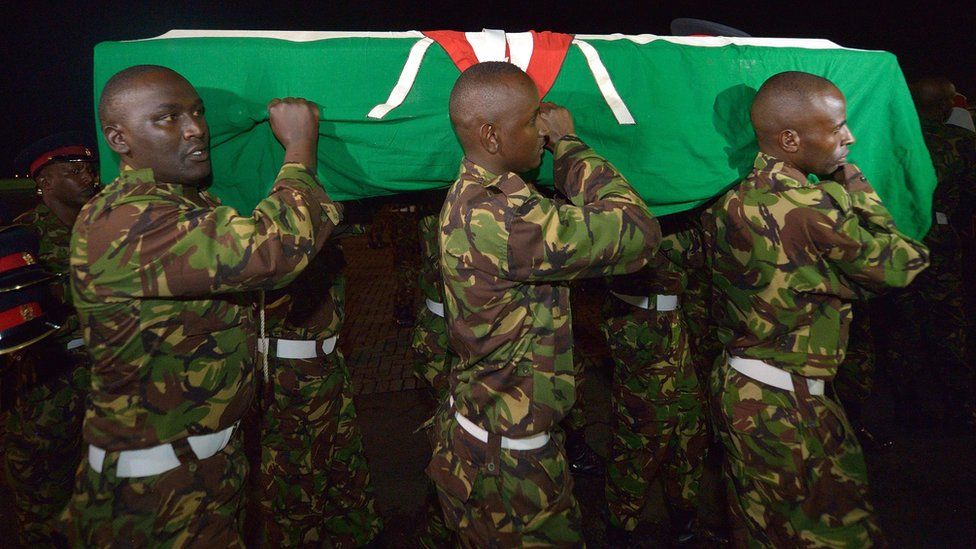 Kenyan soldiers carry the coffin of a colleague killed in Somalia