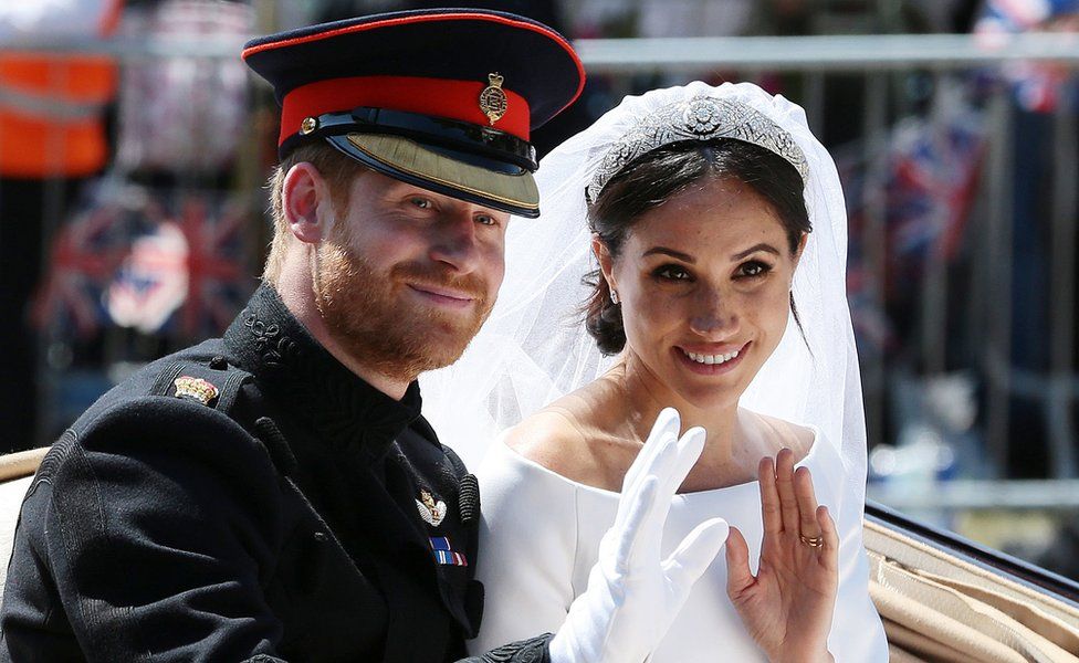 Prince Harry and Meghan Markle in carriage