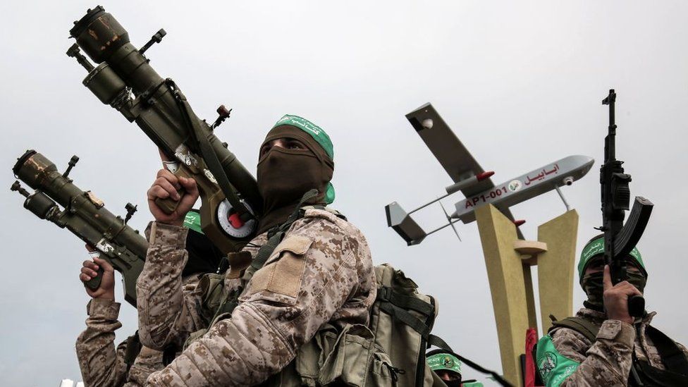 Members of Hamas's military wing, the Izzedine al-Qassam Brigades, attend a memorial in the southern Gaza Strip town of Rafah (31 January 2017)