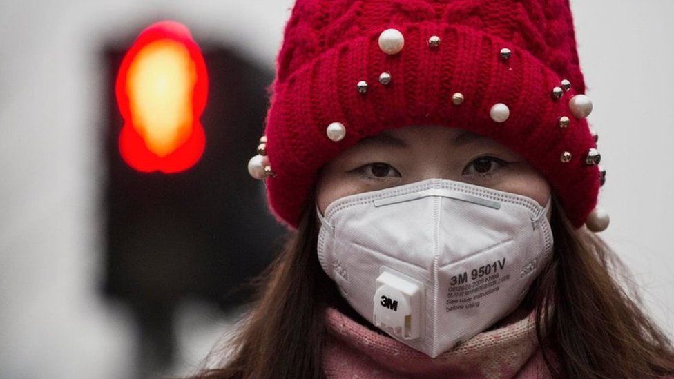 Woman wearing a face mask in China