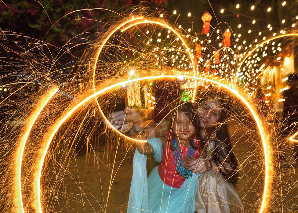 A family celebrates Diwali with firecrackers at Shivaji Park, Dadar on 3 November 2021 in Mumbai, India