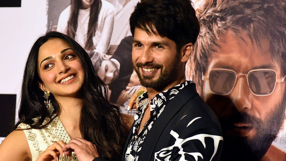 Kiara Advani (L) and Shahid Kapoor (R) pose for photographs during the trailer launch of the upcoming Hindi film 'Kabir Singh' in Mumbai on May 13, 2019.