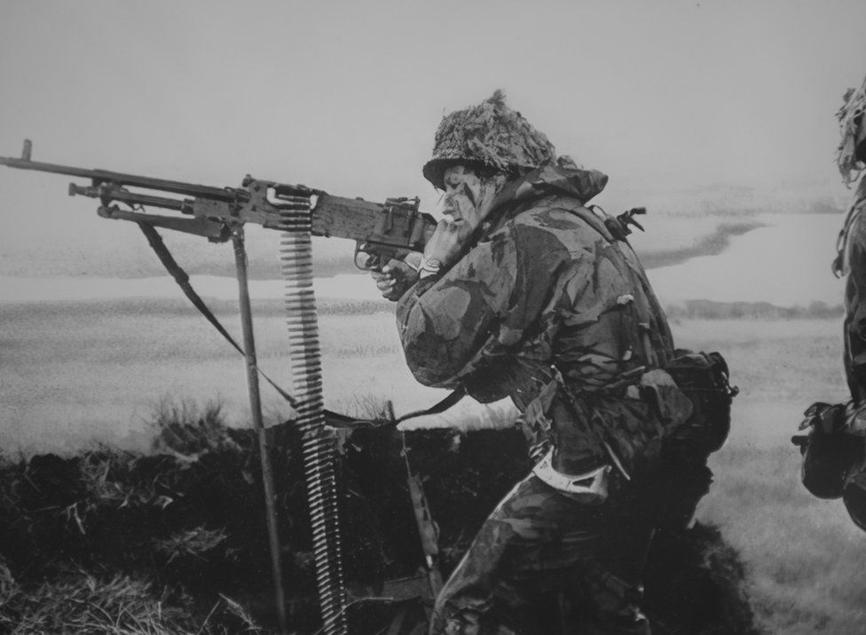 Soldier holding a machine gun