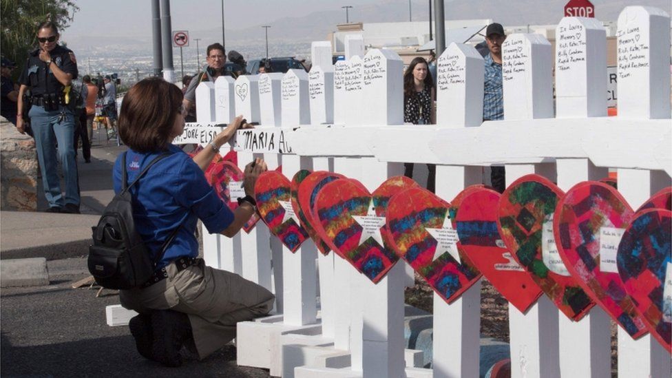 Members of the "Crosses for Losses" group arrive at the scene with crosses for each victim, after the shooting that left 21 people dead at a WalMart in El Paso, Texas