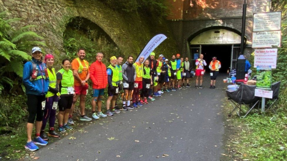 Runners outside Combe Down tunnel